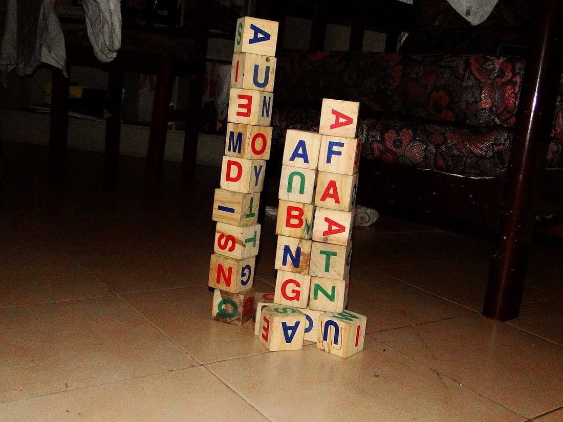Wooden toy blocks stacked on a table